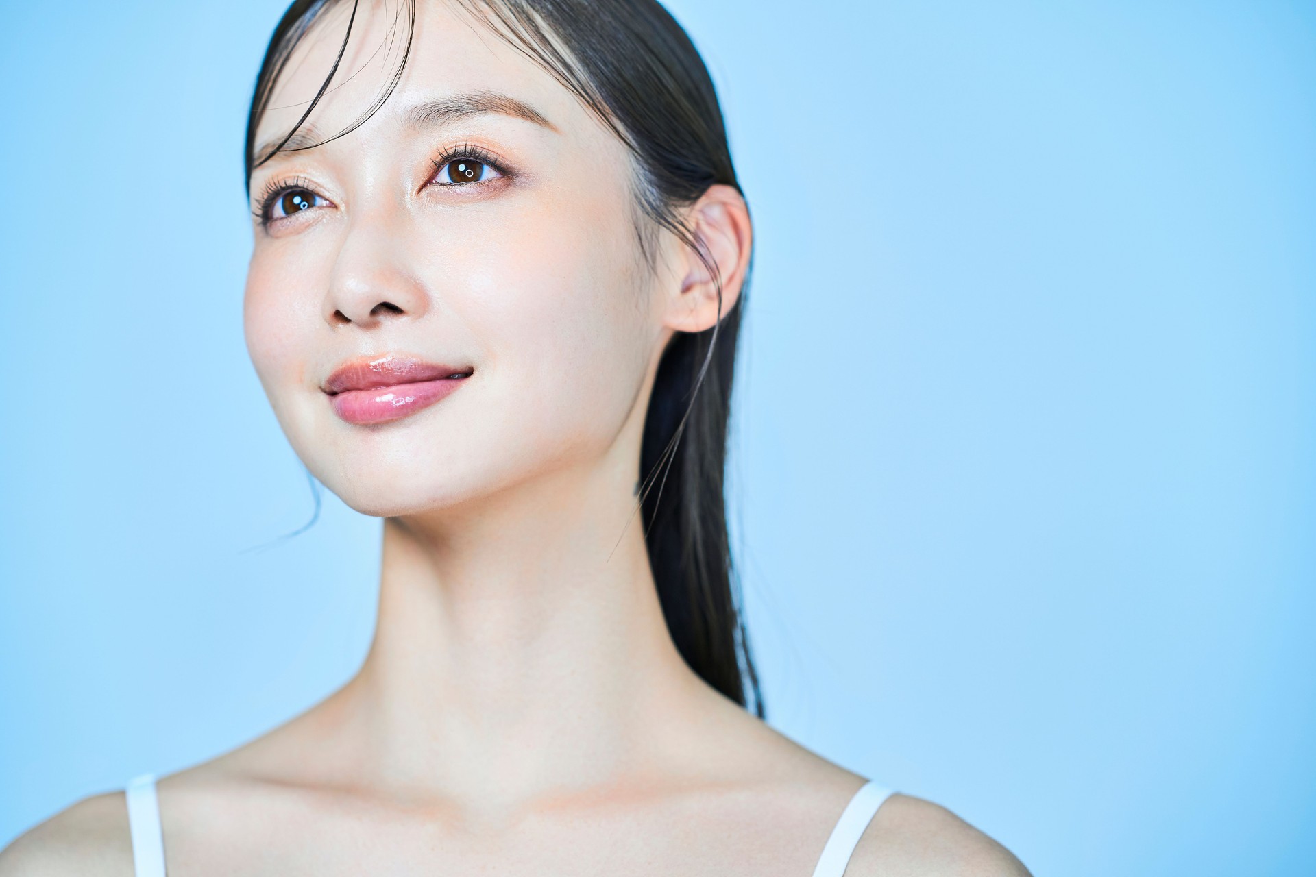 Young woman and light blue background